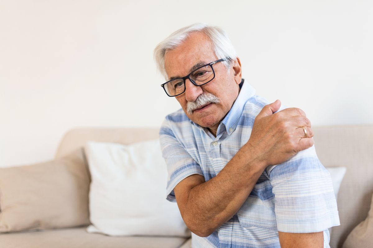 Older man with chronic shoulder pain considering stem cell therapy in Charlotte NC