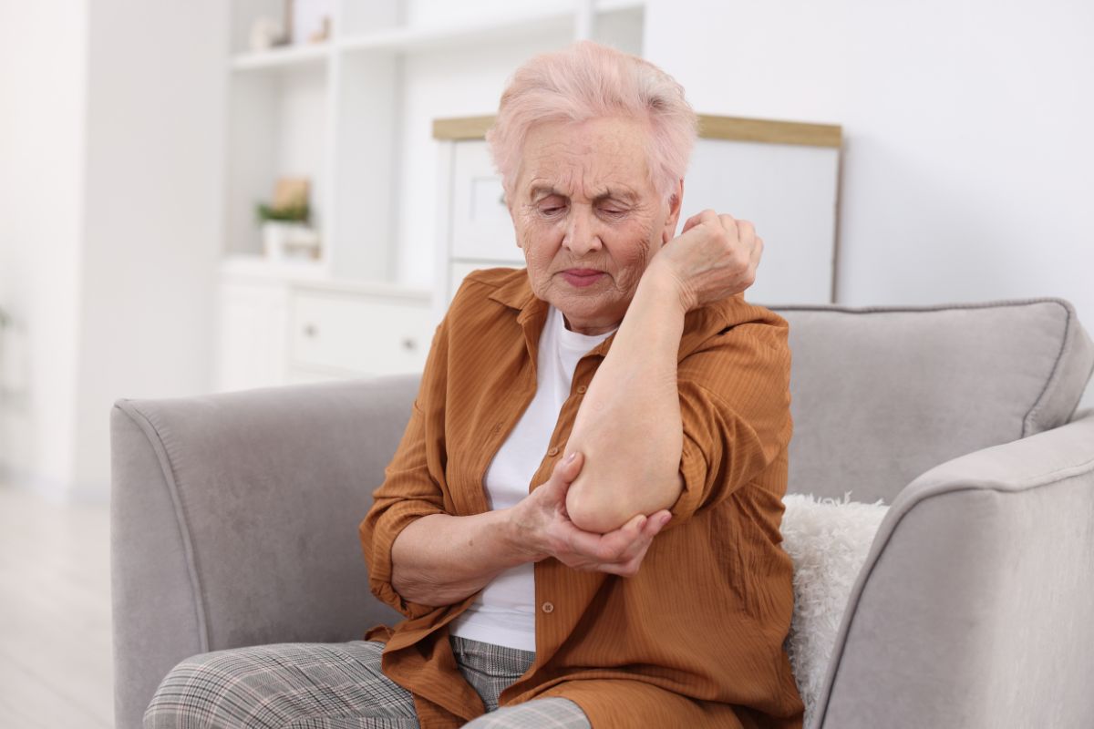 Patient with chronic elbow pain seeking non-surgical stem cell therapy at Stem Cell Carolina Charlotte NC